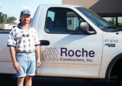 Man in front of Roche Truck