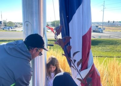 family hanging a flag