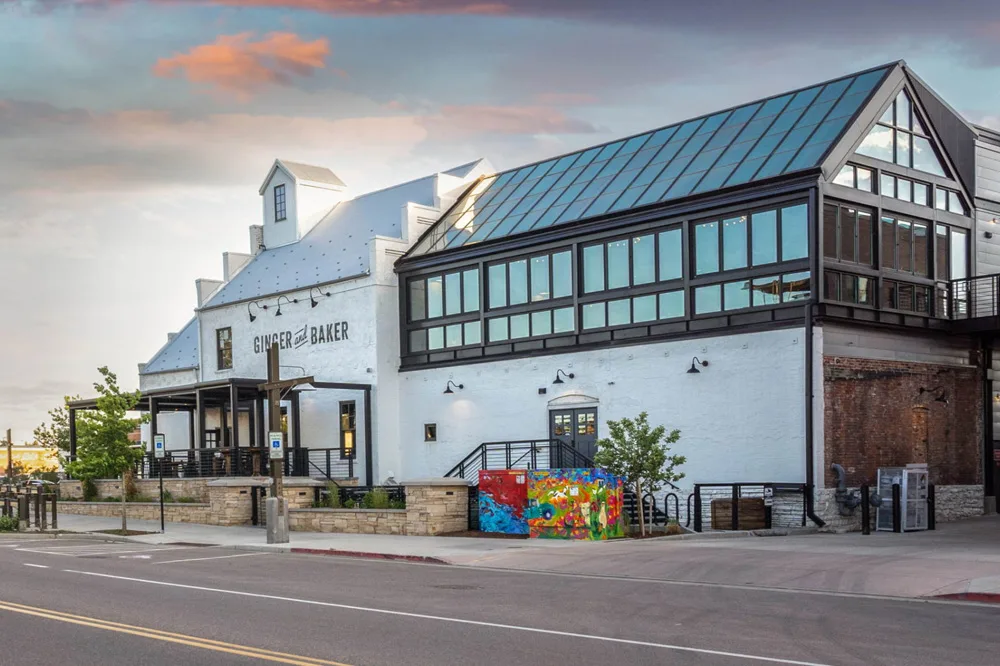 exterior of a restaurant and shop with glass roof top